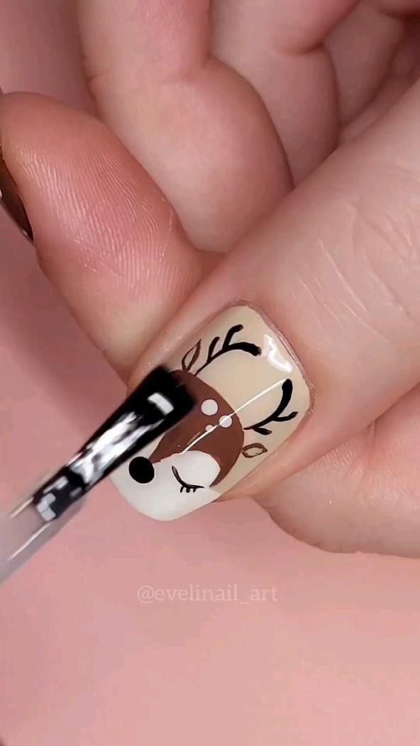 24 Glam Christmas Nail Designs That’ll Make You Shine Bright This Season! - 11. Joyful Reindeer Nail Art 1